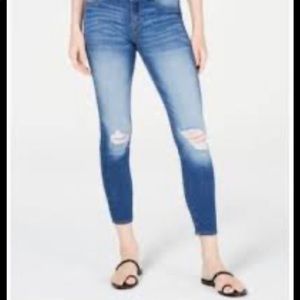 Distressed blue skinny jeans with rips